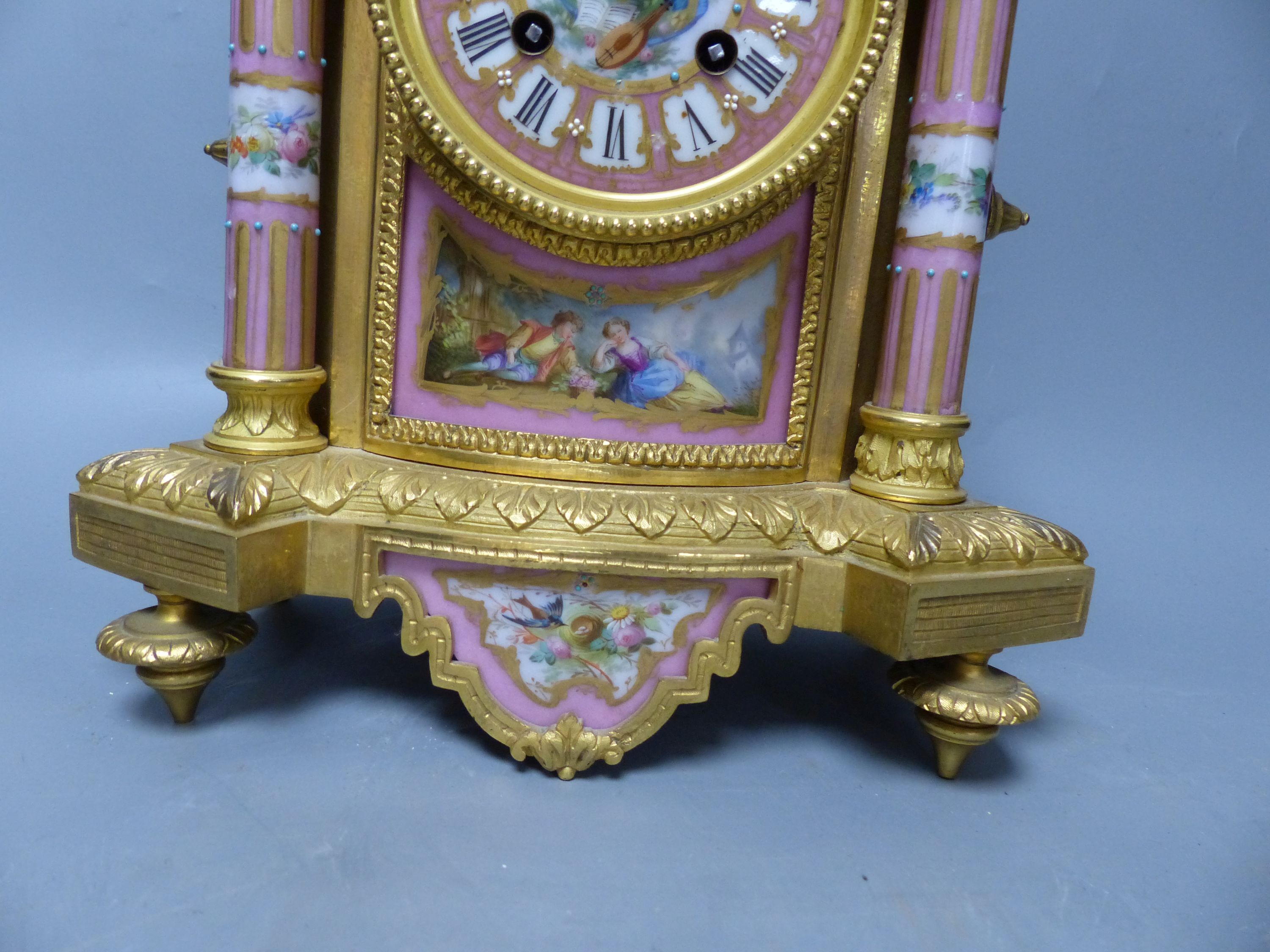 A French ormolu and porcelain mantel clock on plinth, overall height 43cm